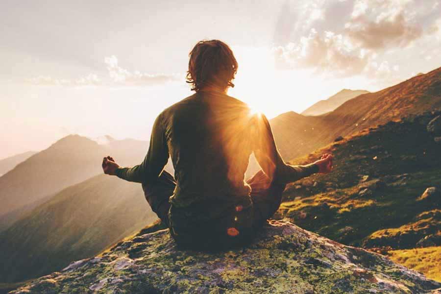 man meditating - connected with himself and the planet