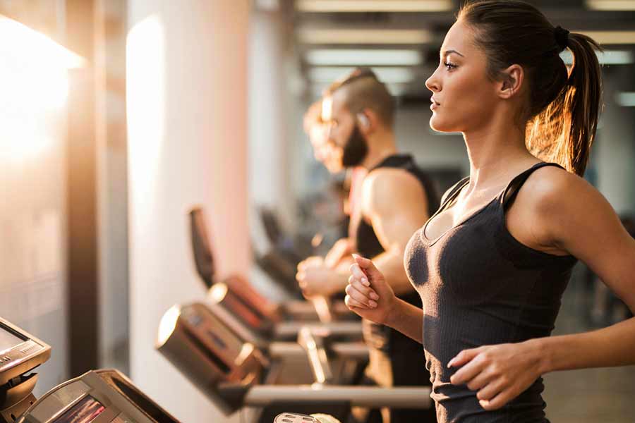 Girl on Treadmill running to lose weight