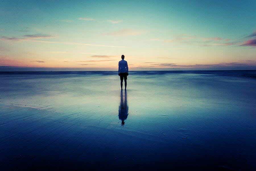 Complete solitude walking on the beach along